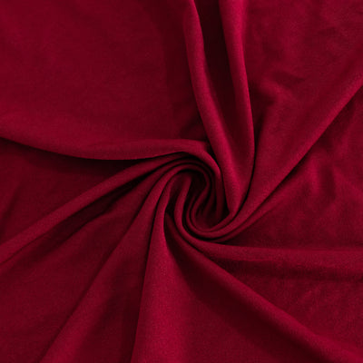 Red fabric texture with soft folds and drapes.