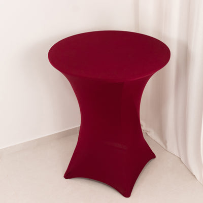 Red stretch table cover for round table in studio setting