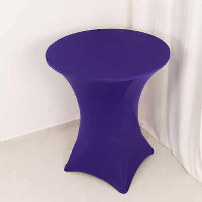 Purple stretch table cover on a round table in a minimalist setting.