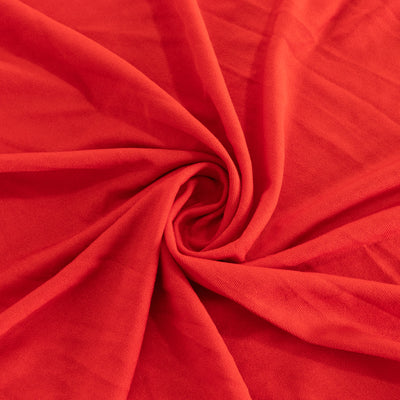 Red fabric texture in a swirling pattern.