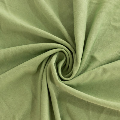 Green fabric with a soft texture, elegantly twisted for display.