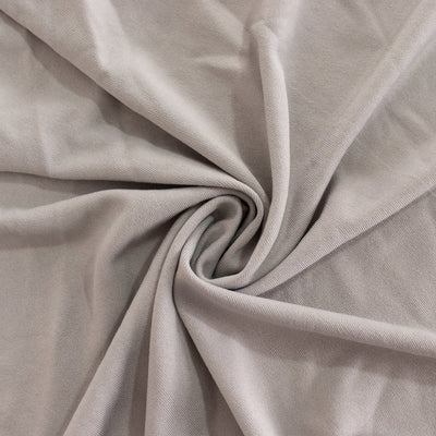 Soft gray fabric with a smooth texture and gentle folds.