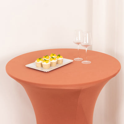 Cupcakes on a table with wine glasses in a stylish setting.