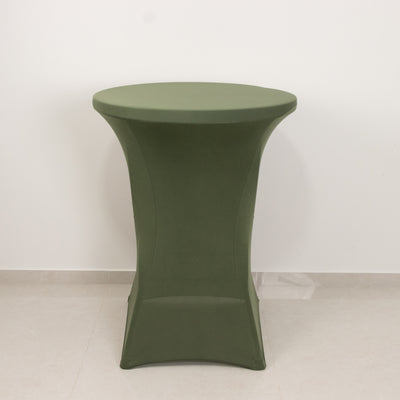 Green round table on a plain background.