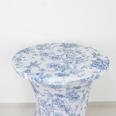 Floral-patterned tablecloth draped over a round table
