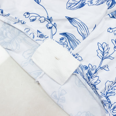 Blue floral fabric with elastic band detail on a white background. #whtbkgd