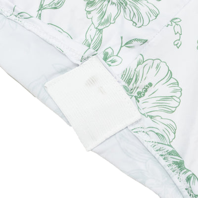 Floral-patterned fabric showing a tag detail. #whtbkgd