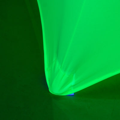 Green fabric corner detail with lighting effects.
