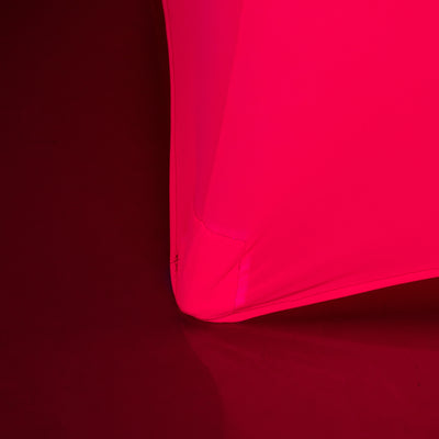 Bright pink fabric corner detail on a contrasting background.