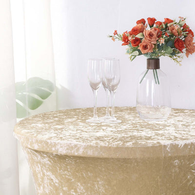 Elegant table setting with champagne glasses and a floral vase.