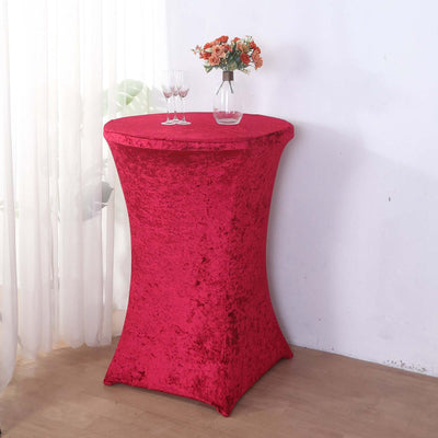 Red stretch table cover for cocktail tables in a bright setting.