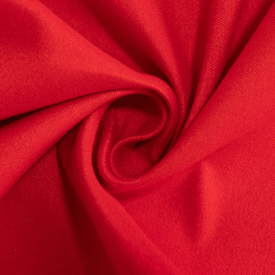 Red fabric texture close-up swirl, showcasing softness and quality.