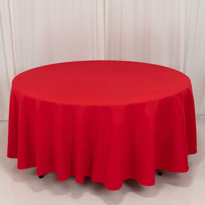 Red round tablecloth draped on a circular table