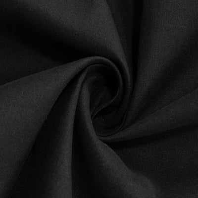 Black fabric texture in a swirling pattern.