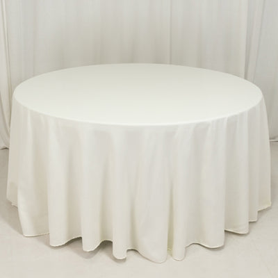 Round white tablecloth draped on a circular table