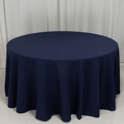 Navy round tablecloth on a white backdrop