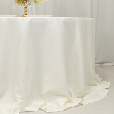 Elegant white tablecloth with soft draping for events and dining