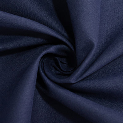 Navy blue fabric with a smooth texture, elegantly twisted in a spiral.