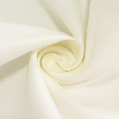 Creamy white fabric swirl showing soft texture and drape.