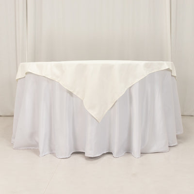 Ivory tablecloth draped elegantly over a round table