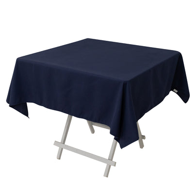 Navy blue tablecloth draped over a white folding table