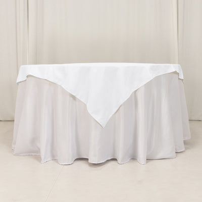 White tablecloth draped elegantly over a round table.