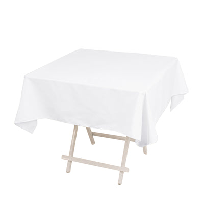 White tablecloth draped over a folding table