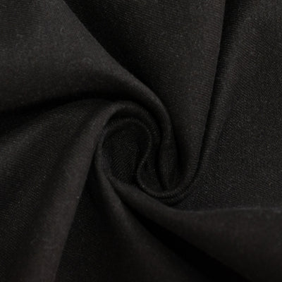 Black fabric texture in a swirling pattern.