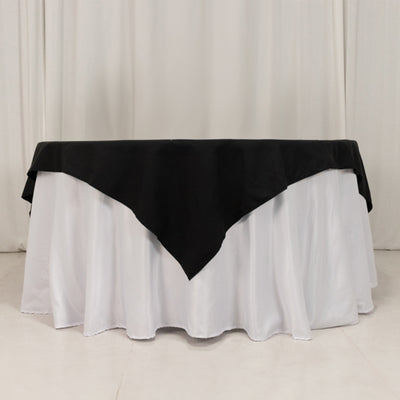Black and white tablecloth with elegant draping for events and dining.