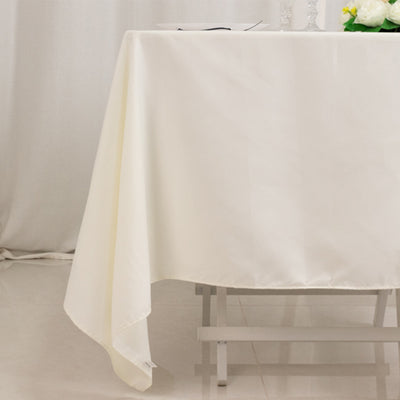 White tablecloth draped over a table, creating an elegant dining setting.