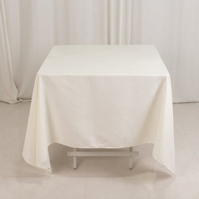 White tablecloth draped over a table in a studio setting.