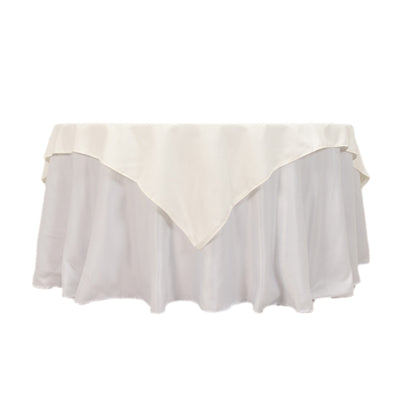 White satin tablecloth with elegant draping and scalloped edges