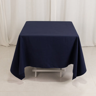 Navy blue tablecloth draped over a square table