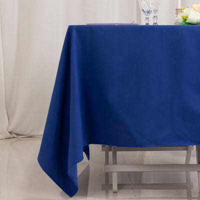 Blue tablecloth draped over a table in a staged setting.
