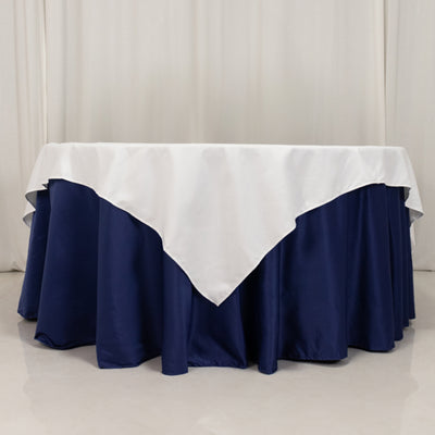 Navy tablecloth with white overlay on a round table