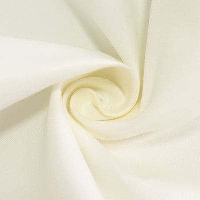 Soft cream fabric swirl showcasing smooth texture.