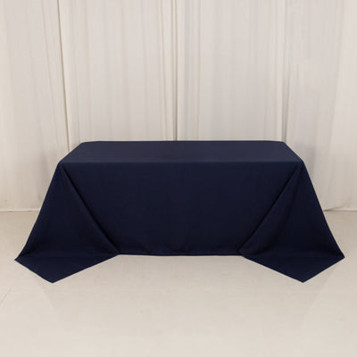 Navy tablecloth draped over a table in a studio setting