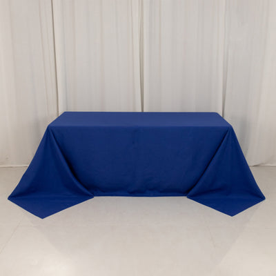 Blue tablecloth draped over a table in a studio setting.