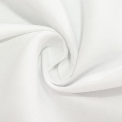 White fabric texture in a circular swirl pattern.