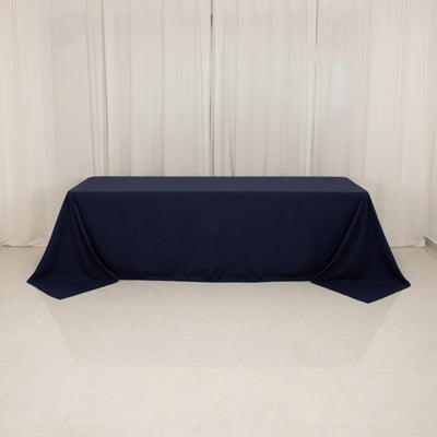 Navy tablecloth draped over a table in a studio setting.