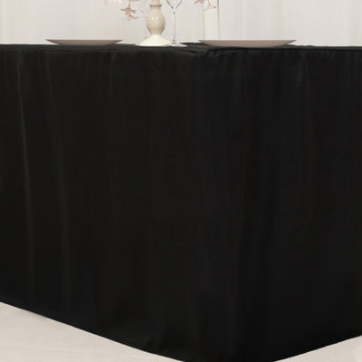 Black tablecloth draped elegantly over a table for formal dining setups.