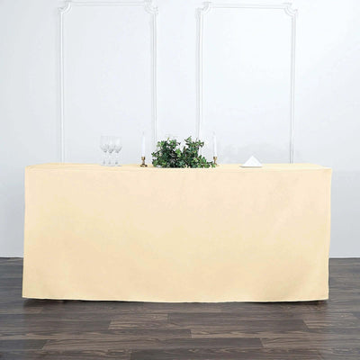 Tablecloth in soft yellow draped over a table for elegant decor.