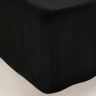 Black tablecloth draping elegantly over a table edge.