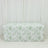 Floral-patterned table cover on a plain backdrop