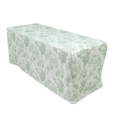 Green floral tablecloth on a table, showcasing elegant design and pattern.