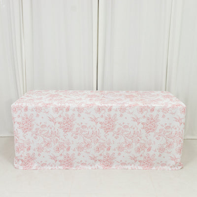 Floral patterned tablecloth draped over a table in a studio setting.