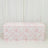 Floral patterned tablecloth draped over a table in a studio setting.