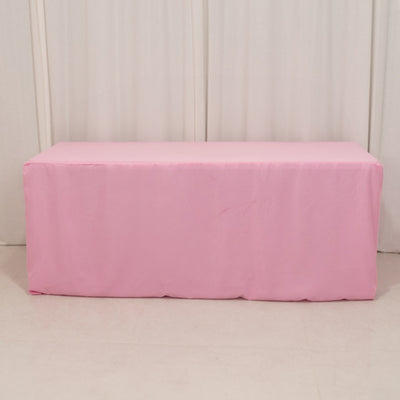 Pink table cover on a plain backdrop.