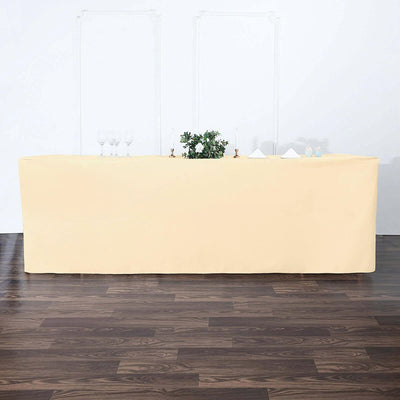 Beige table cover draped over a long table in a minimalist setting.