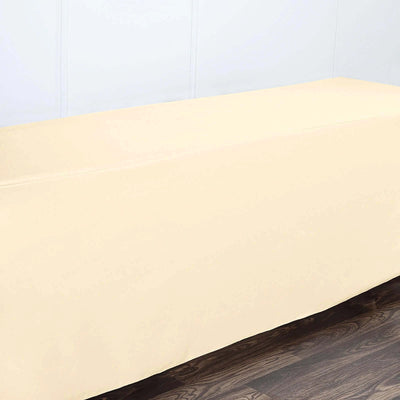 Cream tablecloth on a wooden floor, neatly draped and wrinkle-free.